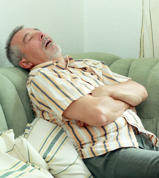 Man asleep on a couch