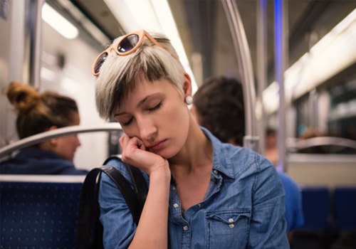 Woman asleep on a train