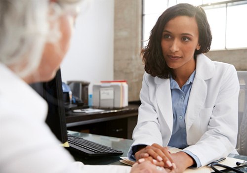 Woman speaking to a doctor