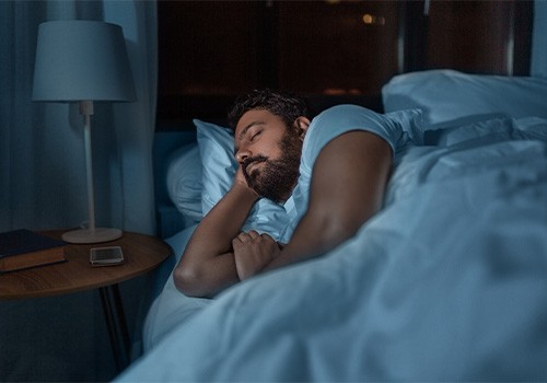 Man sleeping in his comfy bed